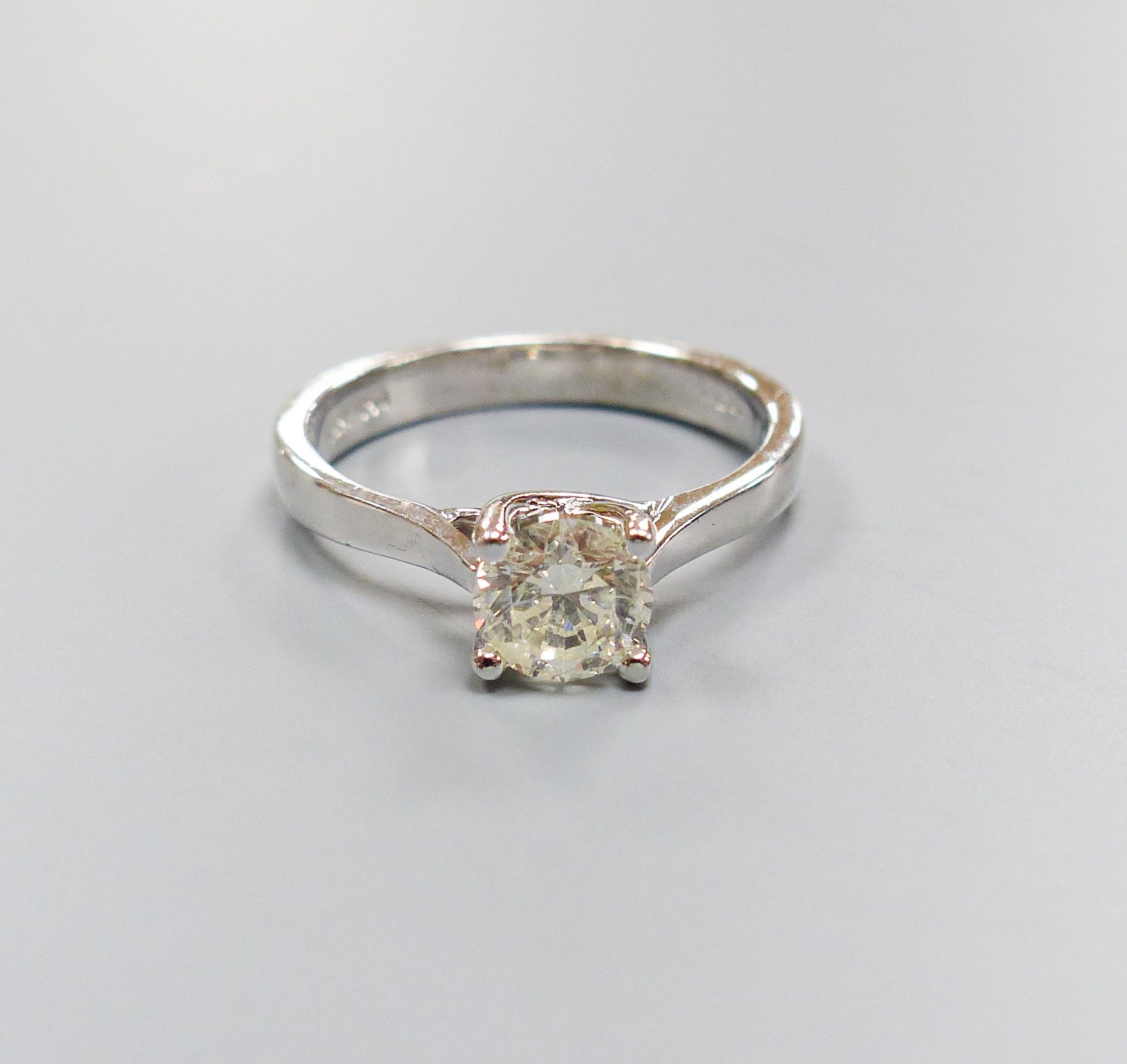 A modern white gold and solitaire diamond ring, size N, gross weight 4.6 grams